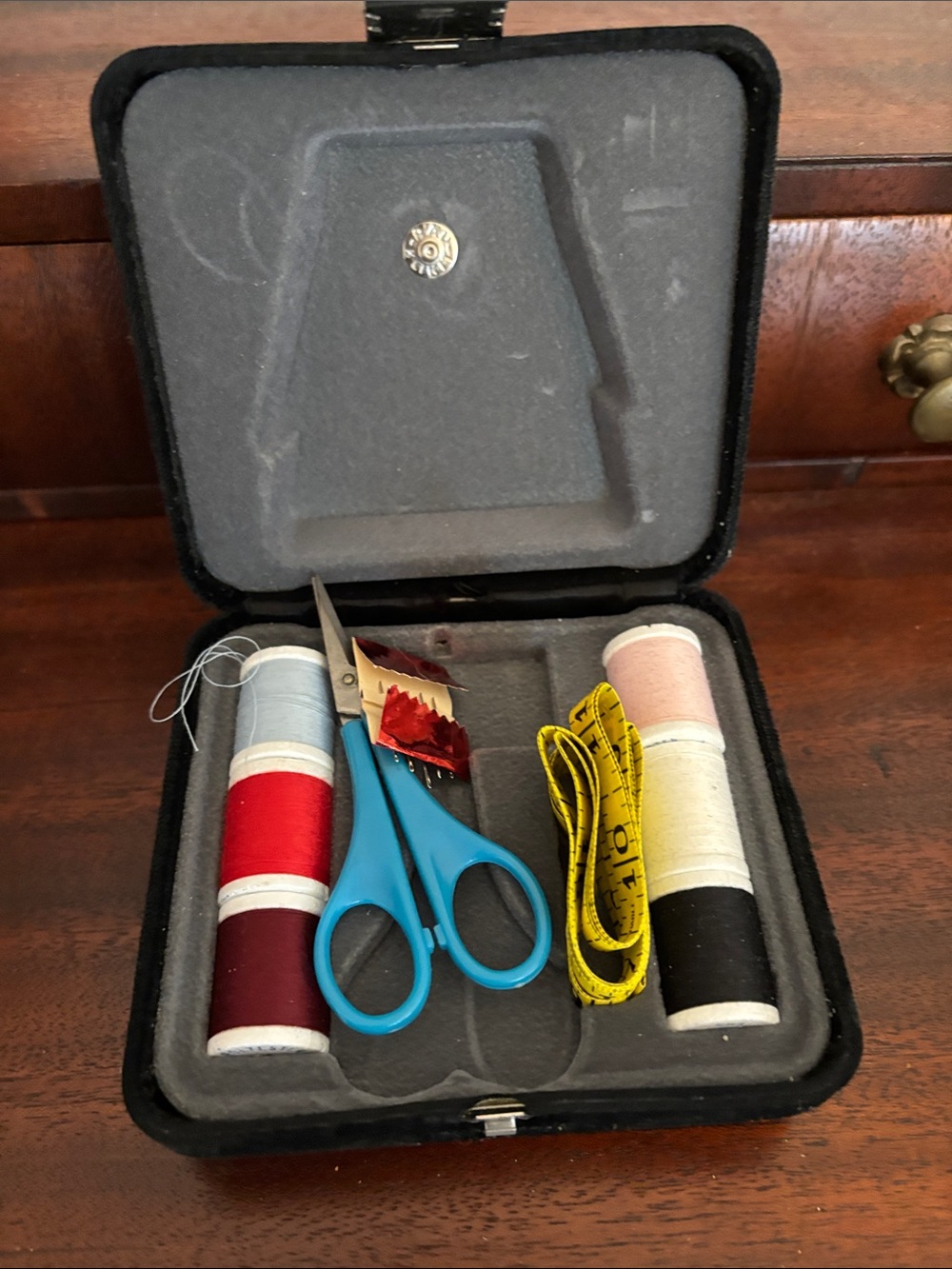Compact Travel Sewing Kit in a black velvet, lined case